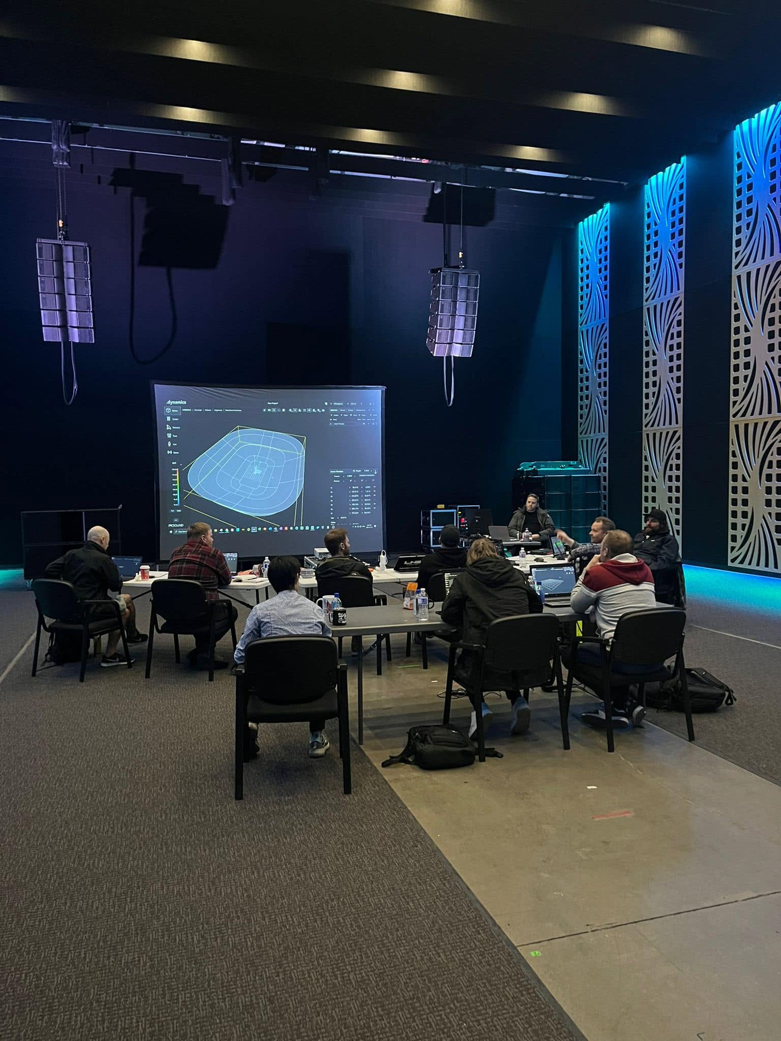 .dynamics certification session with a venue model on screen and robotic arrays flown overhead